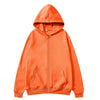 An orange oversized zip-up hoodie with a hood and front pocket.