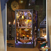A detailed wooden pirate ship book nook kit featuring an intricate interior display and surrounding elements.