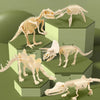 A set of dinosaur fossil skeletons displayed on green hexagonal blocks for an excavation and gem discovery kit.
