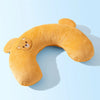 A fluffy orange U-shaped plush pillow shaped like a bear for neck support.