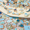 Assorted metal pendants and charms in gold and blue enamel for jewelry making