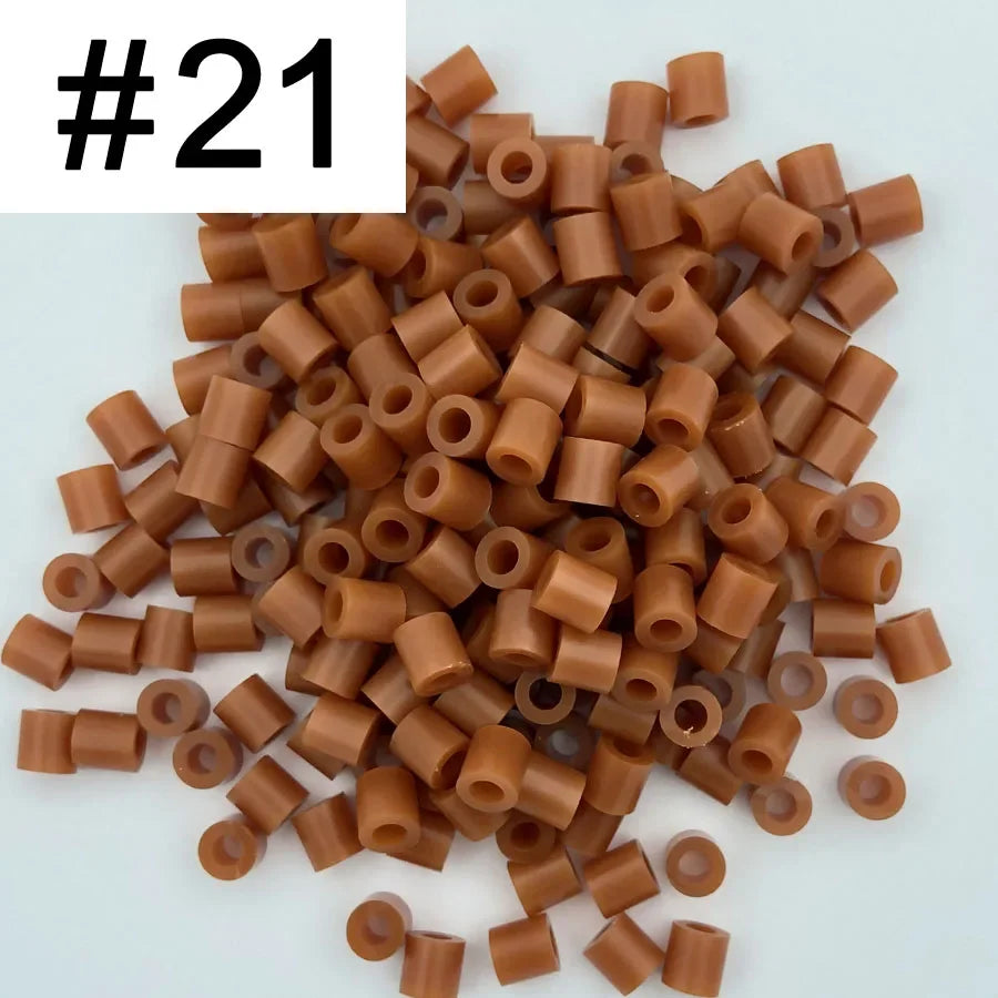 A pile of 1000 assorted 5mm fuse beads in various brown and tan colors for craft projects.
