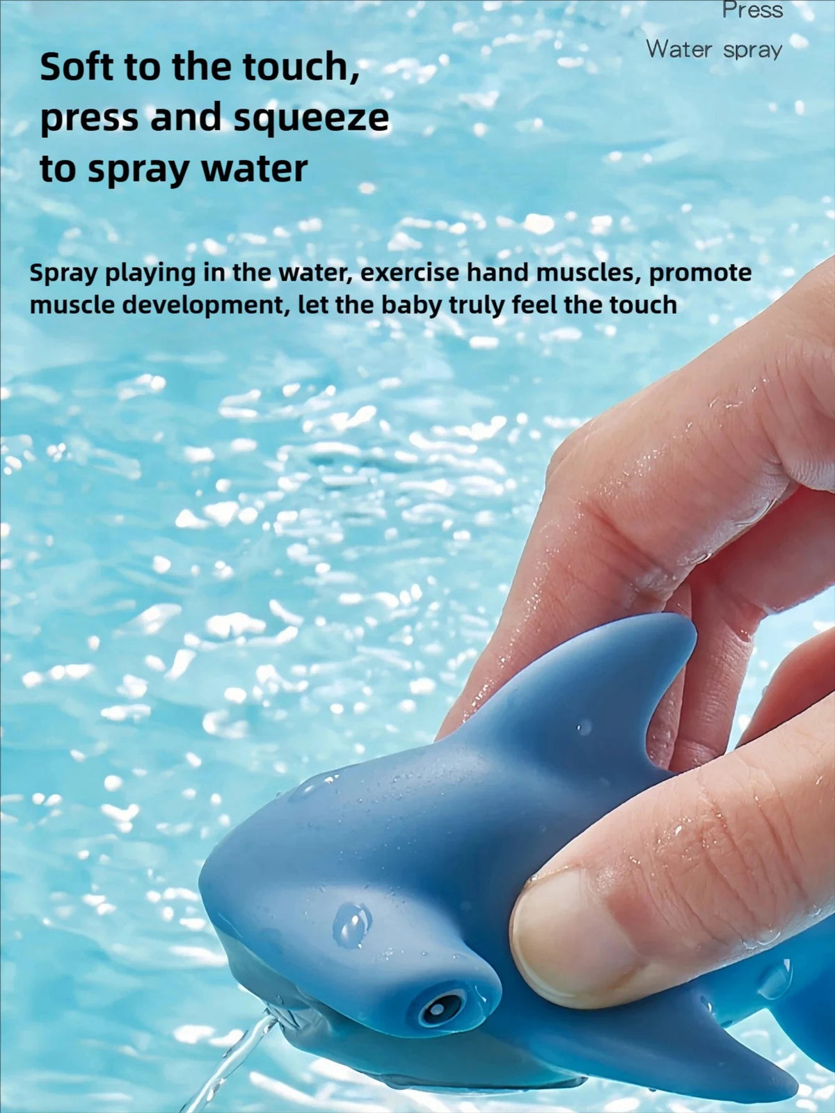 A hand is squeezing a blue water squirting turtle toy into water.