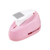 A pink lever action embosser tool with a white plate and a textured stamp