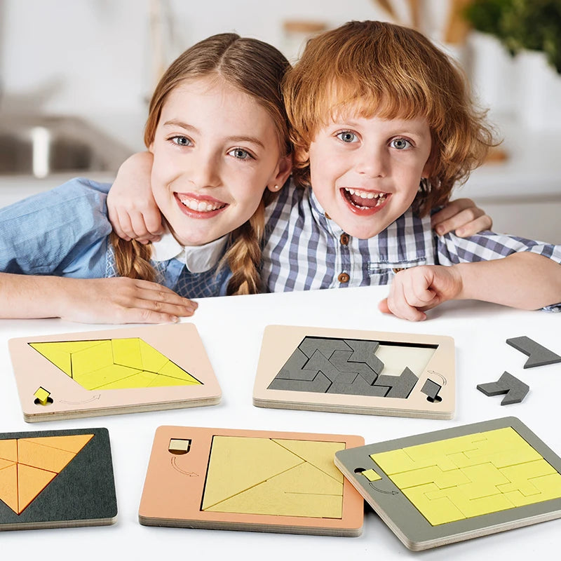 A set of wooden geometric brain teaser puzzles featuring yellow and gray shapes, displayed on a white surface.