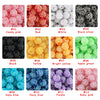 A grid of twelve colored rhinestone resin ball beads for jewelry making, including pink, red, white, black silver, black, yel