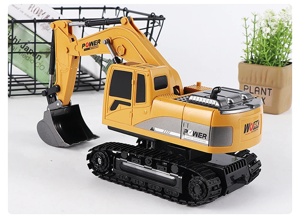 A yellow 1:24 scale remote control excavator with black tracks and a shovel is shown on a white background.