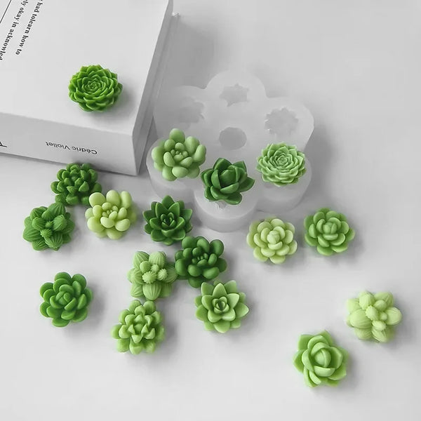 Green succulent flower silicone molds arranged on a white surface.