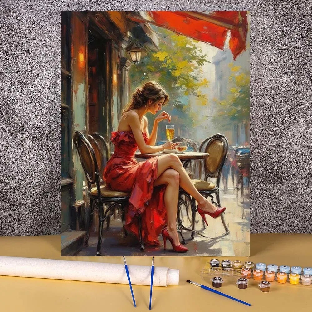 A painting by numbers kit depicting an elegant woman in a red dress sitting at a cafe table.
