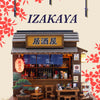 A detailed wooden miniature dollhouse kit of a Japanese izakaya restaurant with signage and interior details.