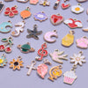 Assortment of gold-tone enamel charms for jewelry making featuring various shapes and designs