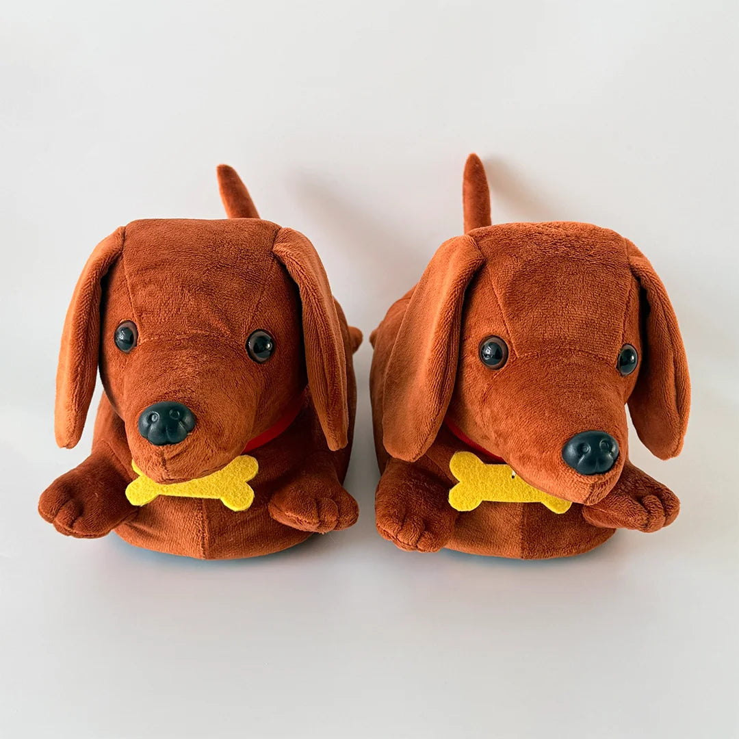 A pair of brown dachshund plush slippers with yellow accents.
