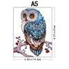 A detailed illustration of an owl with blue feathers and large eyes, used as a jigsaw puzzle design.