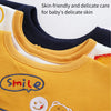 A set of three yellow and navy baby waterproof drool bibs with a smile design