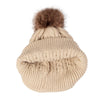 A beige knit winter hat with a faux fur pom, shown from above.