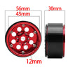 Close-up view of a red metal beadlock wheel with a removable hex hub and various diameter measurements.
