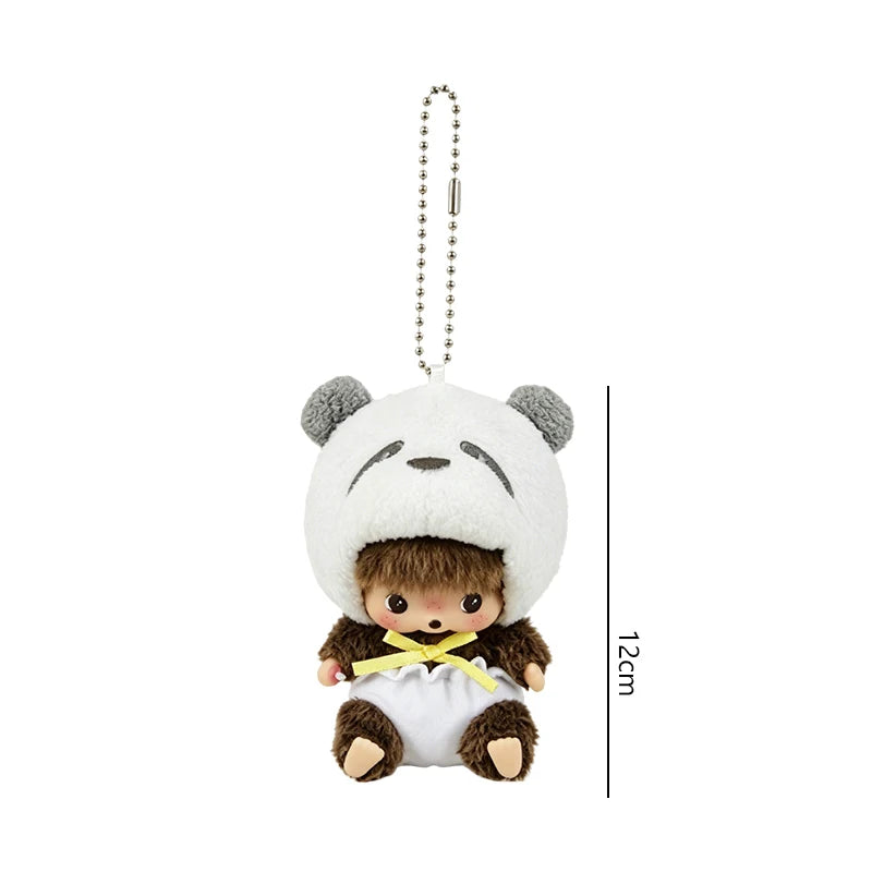 A white bear plush toy with brown accents and a yellow bow, attached to a silver chain.