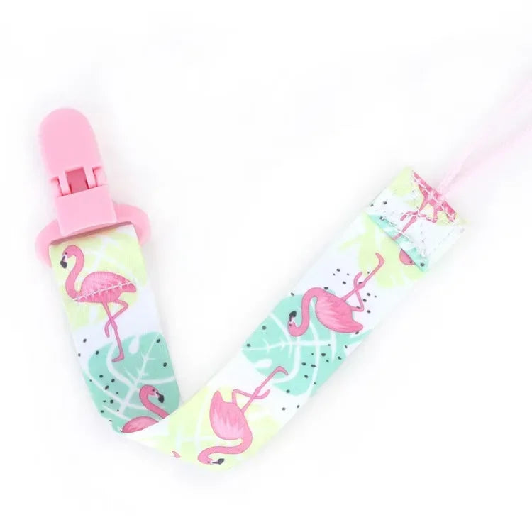 Pink pacifier clips with double-sided prints featuring pink flamingos for babies