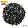 A pile of 5mm black beads, sold in a 500-piece pack, used for craft projects.