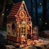 A detailed wooden miniature kit of a time pavilion dollhouse featuring brickwork, stained glass, and decorative elements.