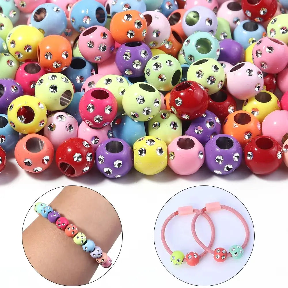 Assortment of colorful rhinestone acrylic spacer beads for jewelry making, shown alongside a string of beaded jewelry.