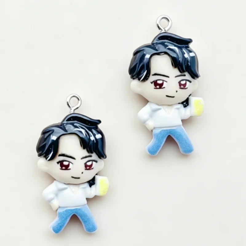 A set of 11 cartoon resin pendant charms depicting a male character with dark hair and white shirt and blue jeans.