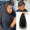 Close-up of a woman with long, black kinky straight crochet hair extensions being styled.
