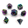 A collection of ten polyhedral dice in various colors and finishes, including pink, black, and iridescent gold.