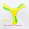 A yellow soft foam boomerang flying disc with green accents.