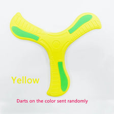A yellow soft foam boomerang flying disc with green accents.