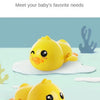 Two yellow wind-up swimming duck bath toys are shown on a light blue background.