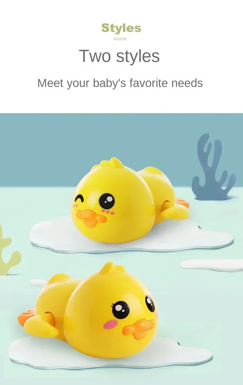 Two yellow wind-up swimming duck bath toys are shown on a light blue background.
