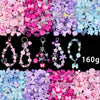 A colorful mix of acrylic beads in pink, purple, and blue for DIY jewelry making