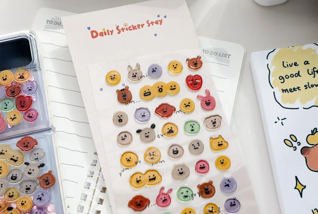 A sheet of Daily Sticker Stay featuring various 3D smile face crystal stickers for crafting and decorating.