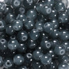 A close-up view of dark gray glass round beads for DIY jewelry making