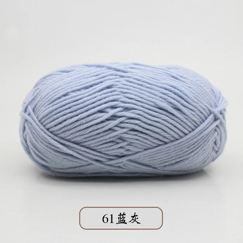 A ball of light blue pre-dyed milk cotton yarn used for knitting and crochet.