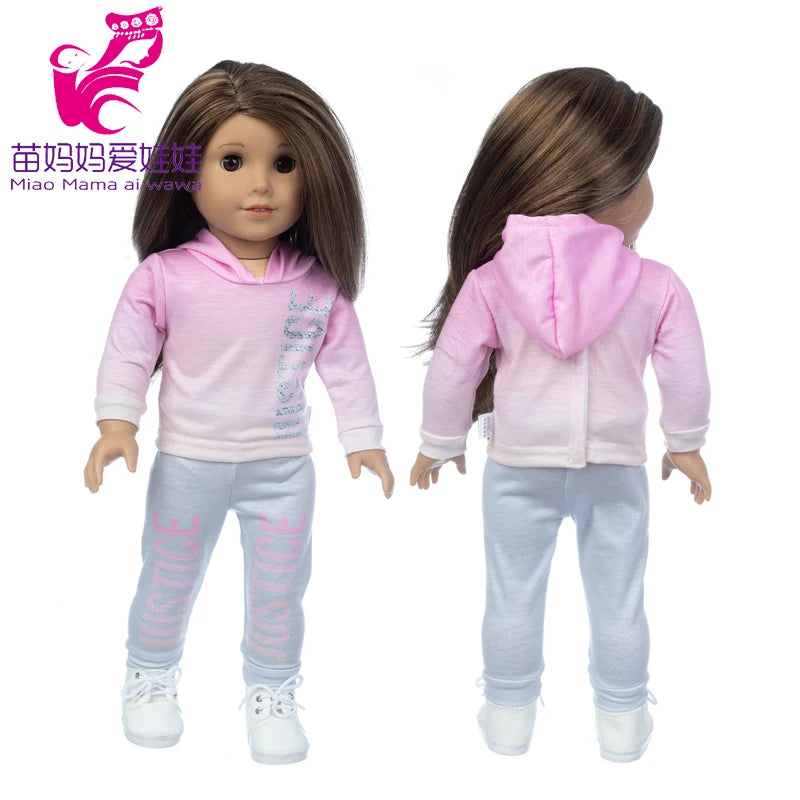 A doll wearing a pink hoodie and light blue pants with matching pink accents.