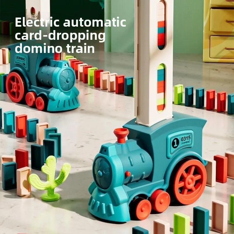 Electric automatic card-dropping domino train toy with colorful blocks on a white surface.