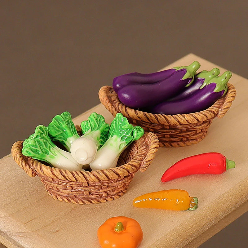 A miniature dollhouse vegetable basket play set showing various colorful bell peppers and a pumpkin in woven baskets.