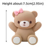 A light brown 3D bear cake topper with pink accents, measuring about 7.5 cm tall.