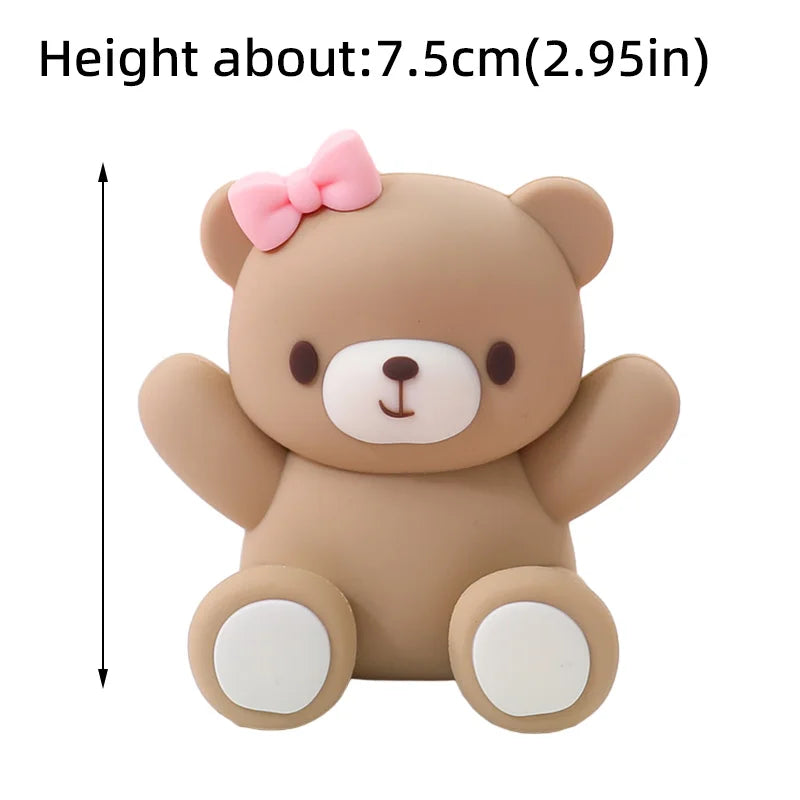 A light brown 3D bear cake topper with pink accents, measuring about 7.5 cm tall.