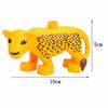 A yellow plastic zoo animal building block shaped like a lion with a leopard print and brown feet.