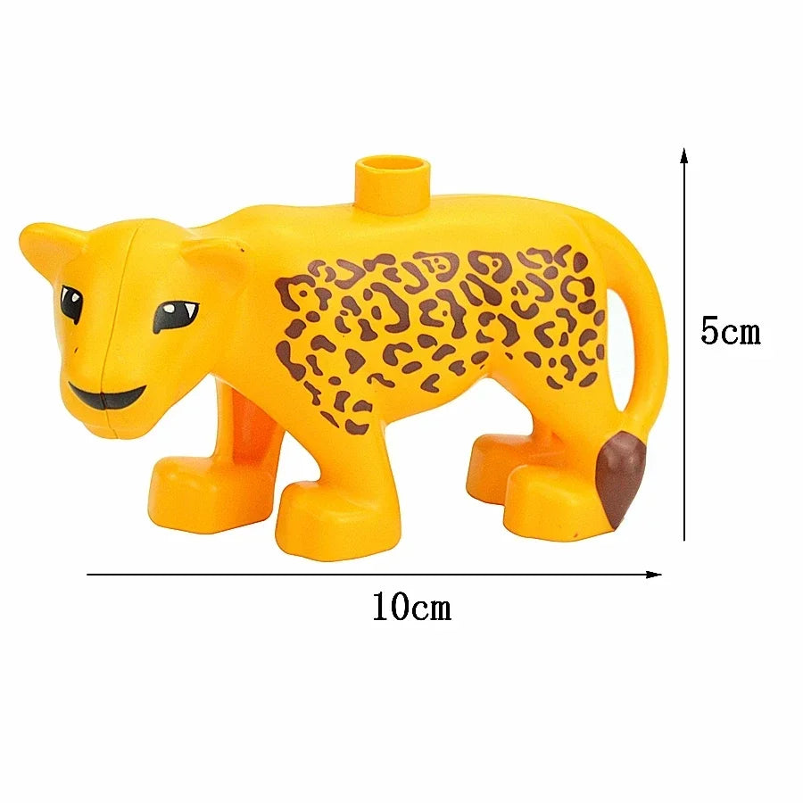 A yellow plastic zoo animal building block shaped like a lion with a leopard print and brown feet.