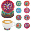 A set of DIY diamond art coasters featuring colorful animal designs like butterflies and birds.