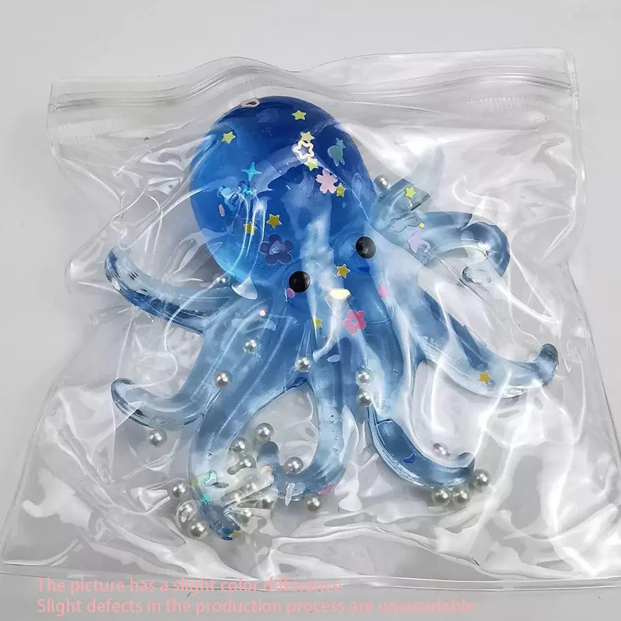 A light blue ocean octopus squishy toy is visible inside a clear plastic bag.