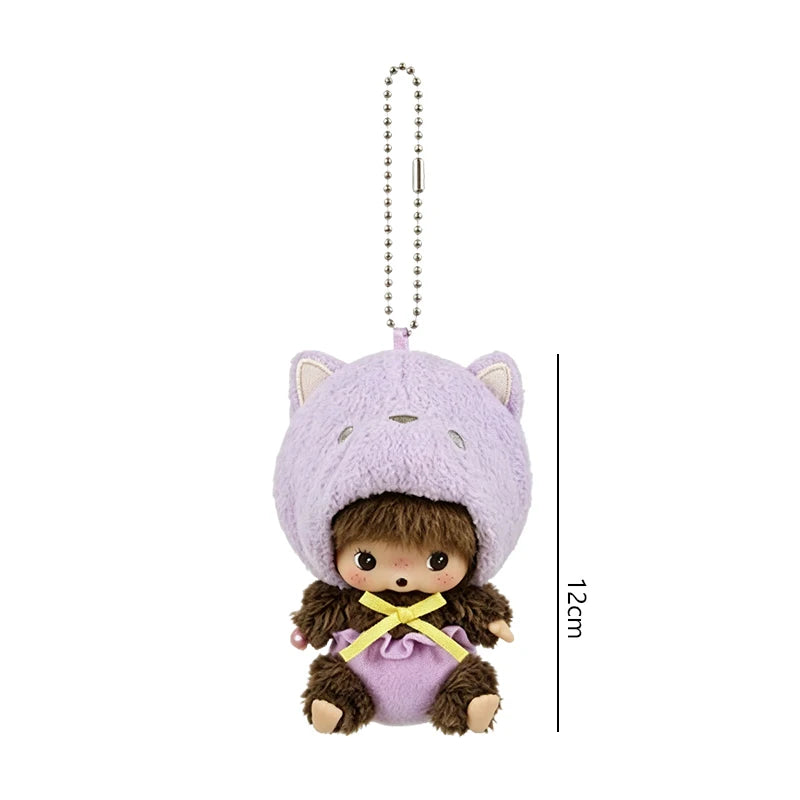 A purple cartoon plush character with large ears and a small brown body is shown hanging from a silver chain.