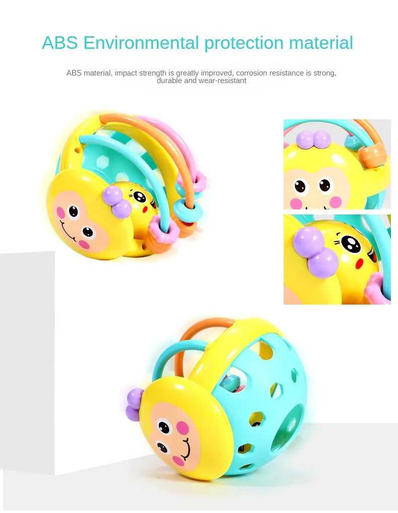 A yellow and teal sensory catch ball rattle toy for babies, featuring soft textures and bright colors.