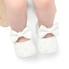 Pair of white baby girl bow-knot first walker shoes with soft anti-slip soles