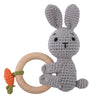A gray knitted rabbit rattle and teether ring made of wood