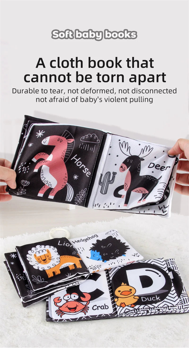 A set of durable cloth baby books featuring animals like a horse, deer, lion, hedgehog, and duck.